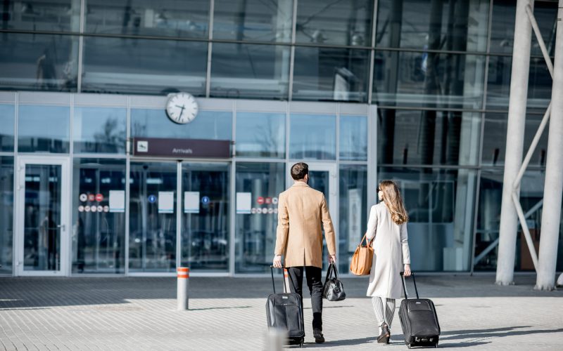 Business couple walking to the airport