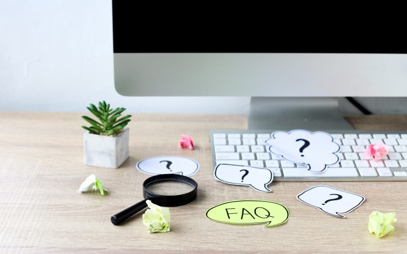 FAQ concept at office desk